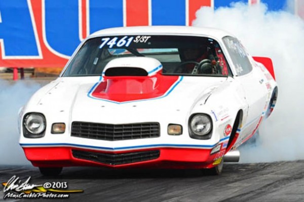second gen chevy camaro pro stock drag car doing a burnout