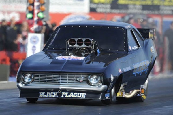 black plague chevy camaro funny car launching at strip