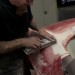 man sanding bodywork on a car thumbnail