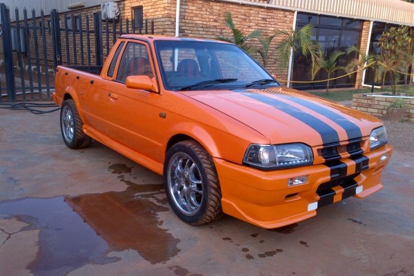 foreign market sport truck with orange and black paint