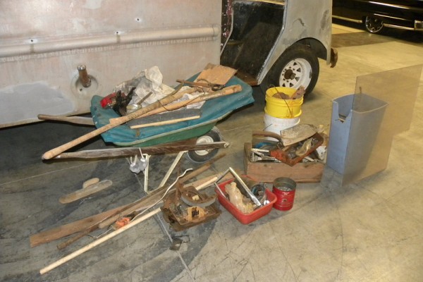pile of tools resting on a shop floor