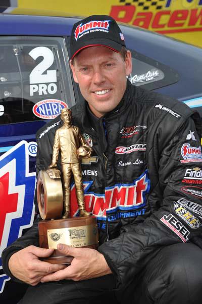 Jason Line holding wally trophy after 2013 NHRA Springnationals