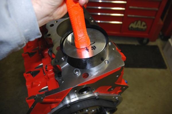 installing a piston with a hammer handle