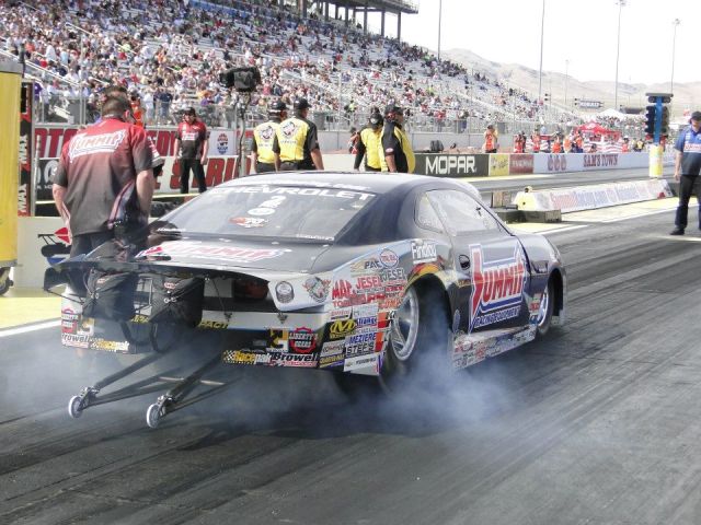 Summit Racing NHRA pro stock camaro doing a burnout