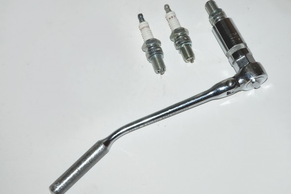 spark plugs and a socket wrench