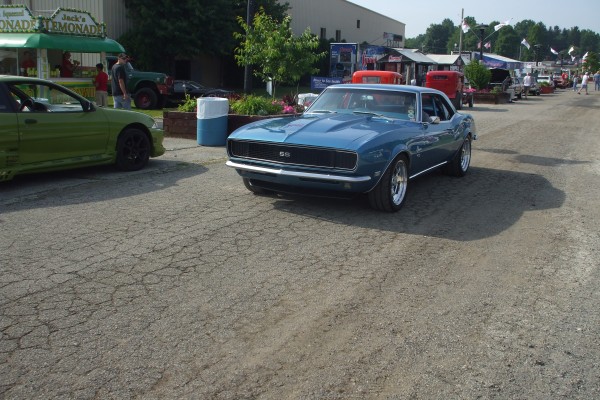 blue 1968 chevy camaro rs ss entering car show