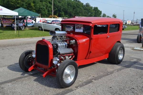 red hot rod tudor coupe with supercharged v8