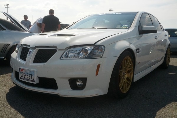 white Pontiac G8 sedan with custom wheels
