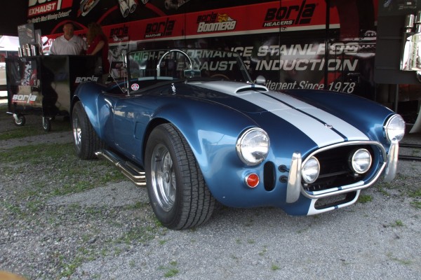 Shelby cobra kit car displayed at automotive trade show