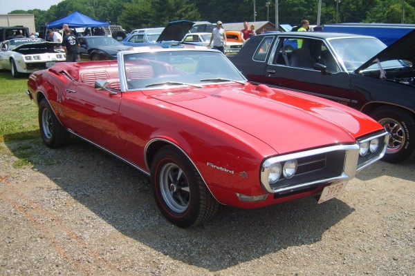 1968 pontiac firebird convertible at a car show