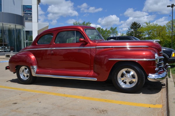 side profile view of a hot rod antique plymouth coupe