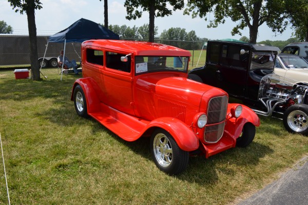 ford tudor coupe hot rod with red paint and custom wheels