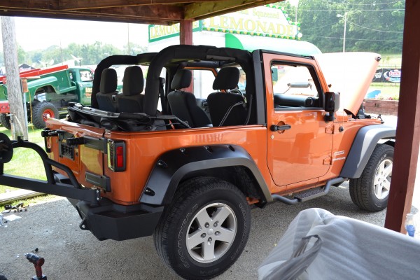 jeep underneath a pavilion at a car show