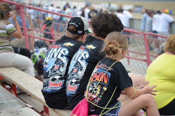 group of kids watching a drag race
