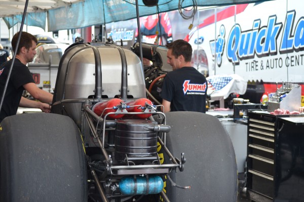 crews working on an nhra funny car