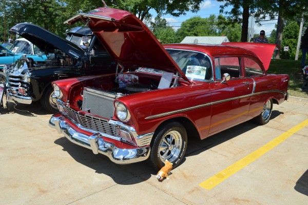 red 1956 Chevy hot rod coupe at car show, 2013