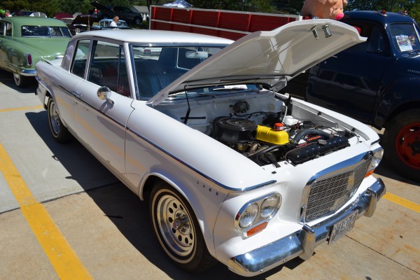 White Studebaker lark with inline six engine