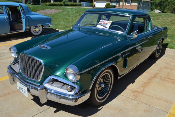 vintage studebaker coupe at a classic car show