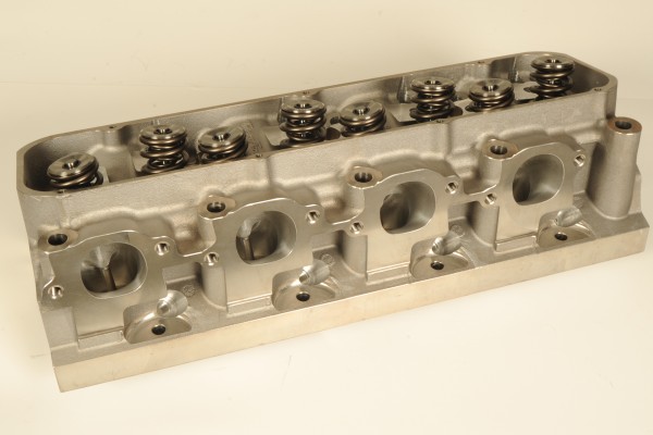 trick flow power port cylinder head on a workbench