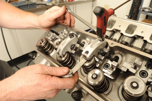 checking valve lash with a feeler gauge