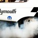 close up of a wheel during a burnout at a drag strip thumbnail