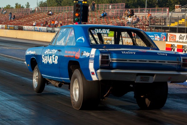 a dodge dart gt sport launching at a drag race