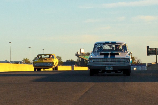 a pair of mopar drag cars running down end of drag strip