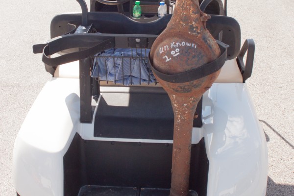 used muscle car axle strapped to the back of a golf cart