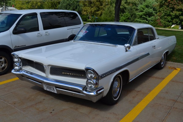 vintage pontiac bonneville coupe at a vintage car show