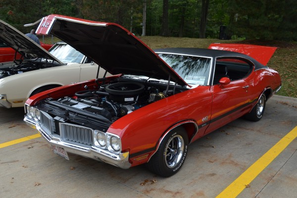 orange red oldsmobile 442 fastback muscle car, front