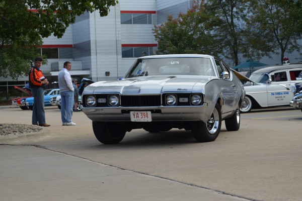 oldsmobile cutlass fastback coupe driving from car show