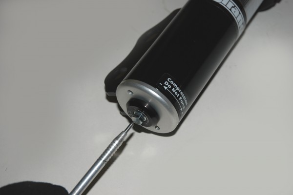 pointing to a shock adjustment knob