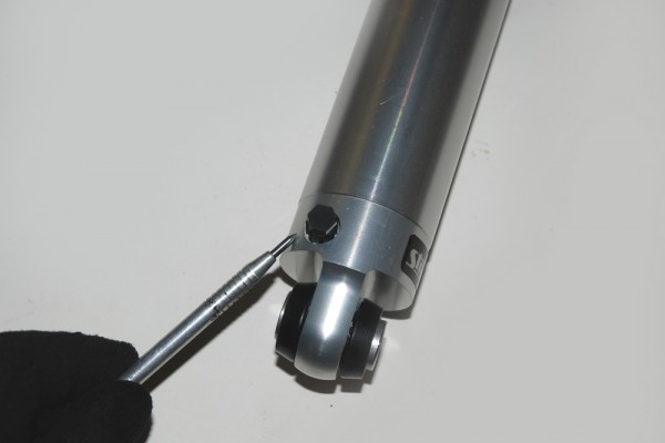 pointing to a shock adjustment knob