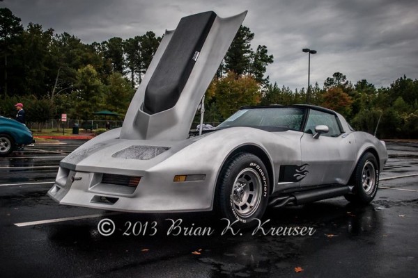Customized C3 Corvette with Monza style headlights and big block hood