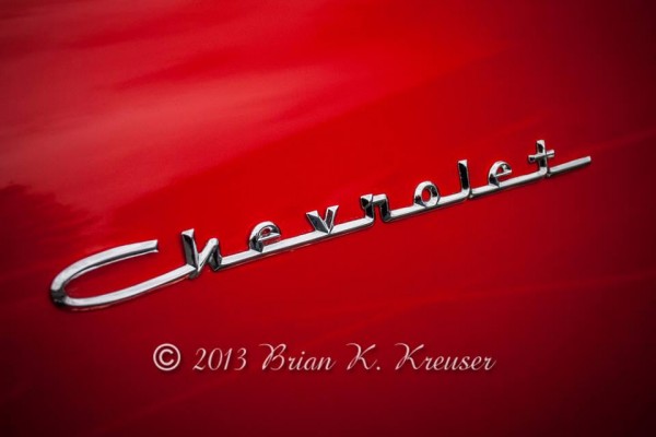 Close up of script Chevrolet emblem on fender of a classic car