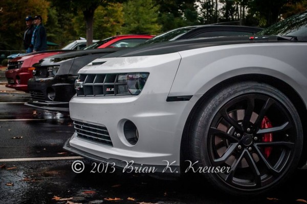 row of late model camaros at a car show