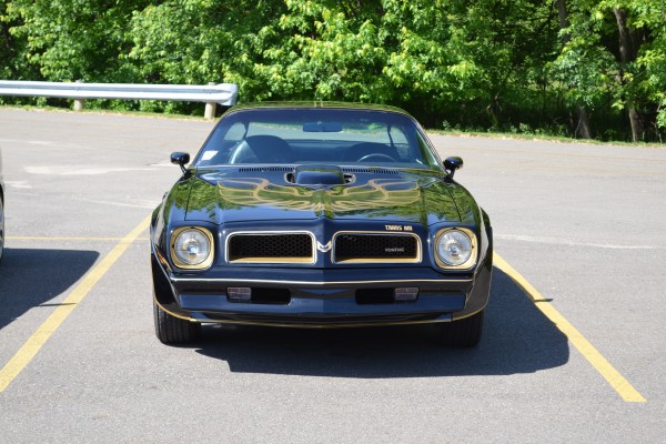 1976 pontiac trans am in a parking lot