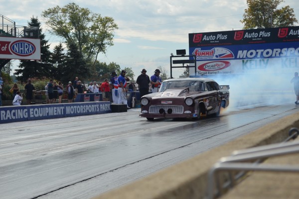 1955 chevy camaro drag car doing a burnout prior to a race
