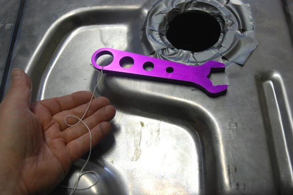string attached to a AN wrench