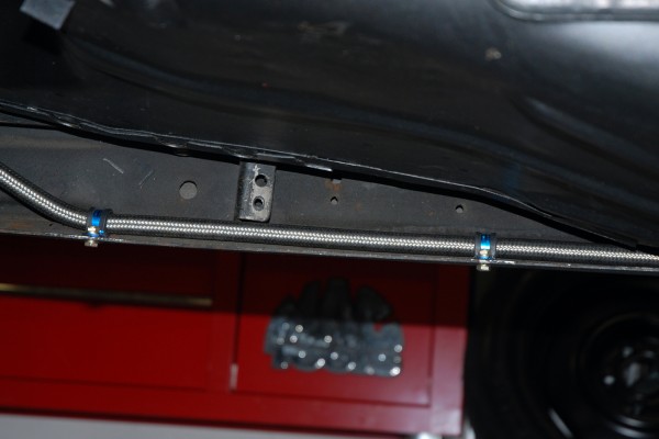 fuel line routed along frame rail of a race car