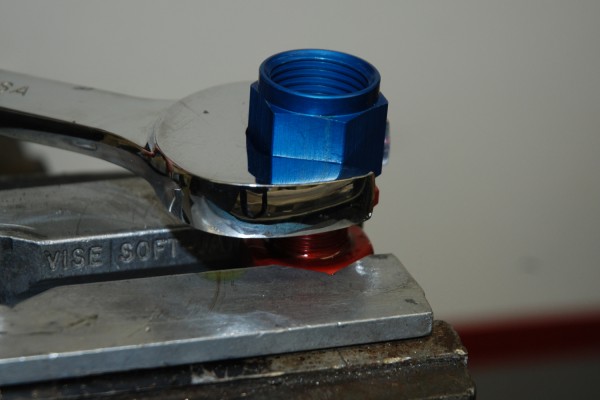 tightening the fitting on a fuel hose