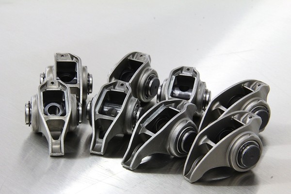 gm ls7 rocker arms arranged on a work table