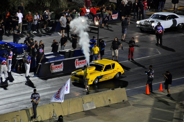 amc gremlin drag car purging nitrous system prior to a drag race