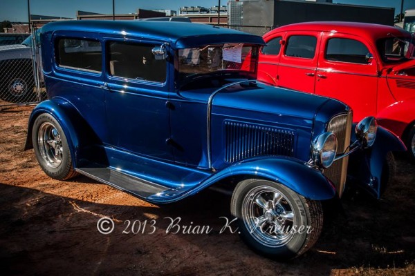 vintage prewar ford tudor hot rod coupe at a car show