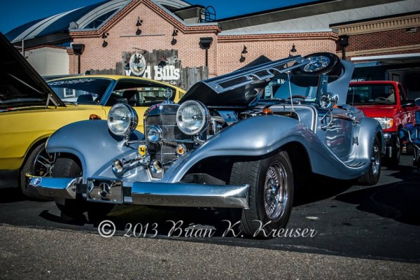 nouveau classic excalibur luxury coupe at car show