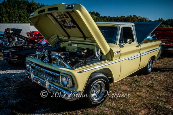 chevy c10 truck on display at a car show