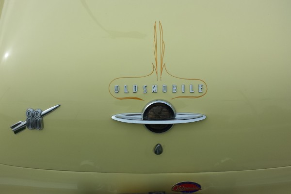 rear pinstriped trunk lid and emblem of a 1950 Oldsmobile 88 coupe