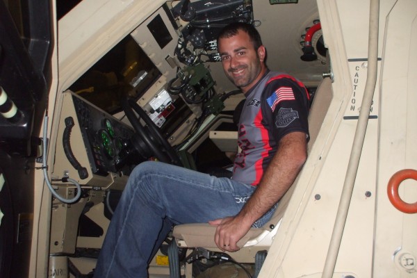 nhra driver in military vehicle during an overseas base visit