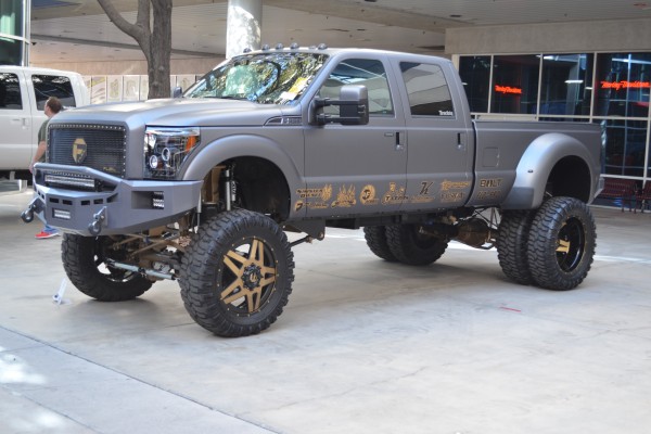 lifted ford super duty truck displayed outside at SEMA 2013