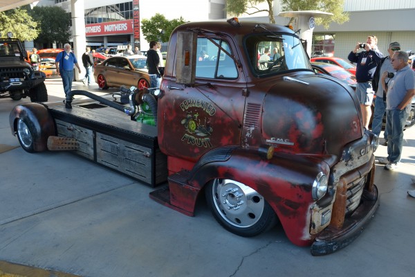 vintage GMC flatbed hauler with cummins diesel in back